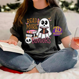 Read More Booooks Halloween ghost t-shirt featuring a cute ghost reading books – cozy fall shirt for book lovers and spooky season vibes.
