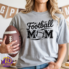 Load image into Gallery viewer, Woman wearing a sports gray Football Mom shirt with black distressed lettering and football graphic
